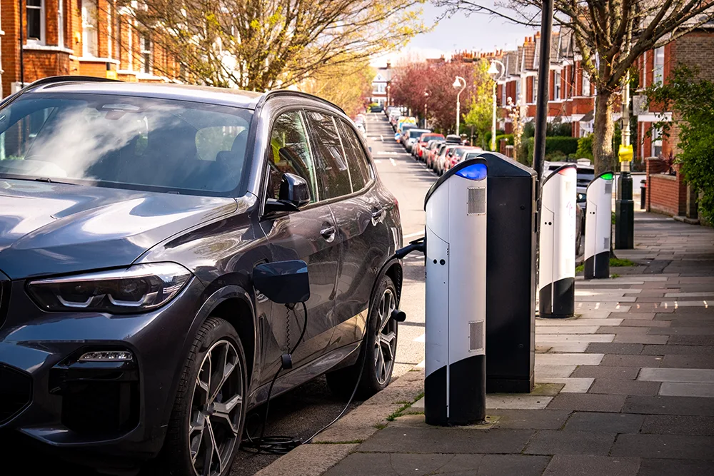 Image shows an EV charging on a street in the UK